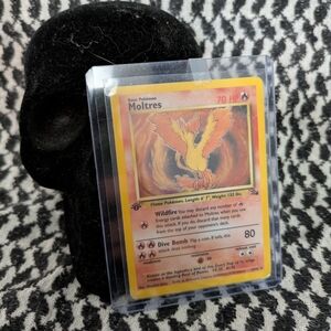 Holo First Edition Moltres Pokémon Card in Protective Case